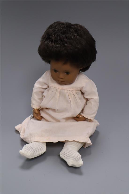 A vintage Sasha baby doll, with original metal tag on wrist, excellent condition